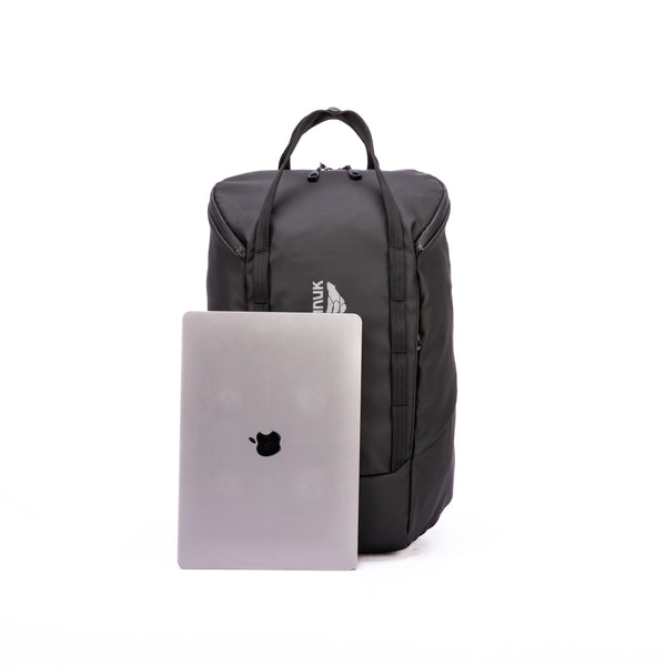 Black backpack with a laptop on a white background