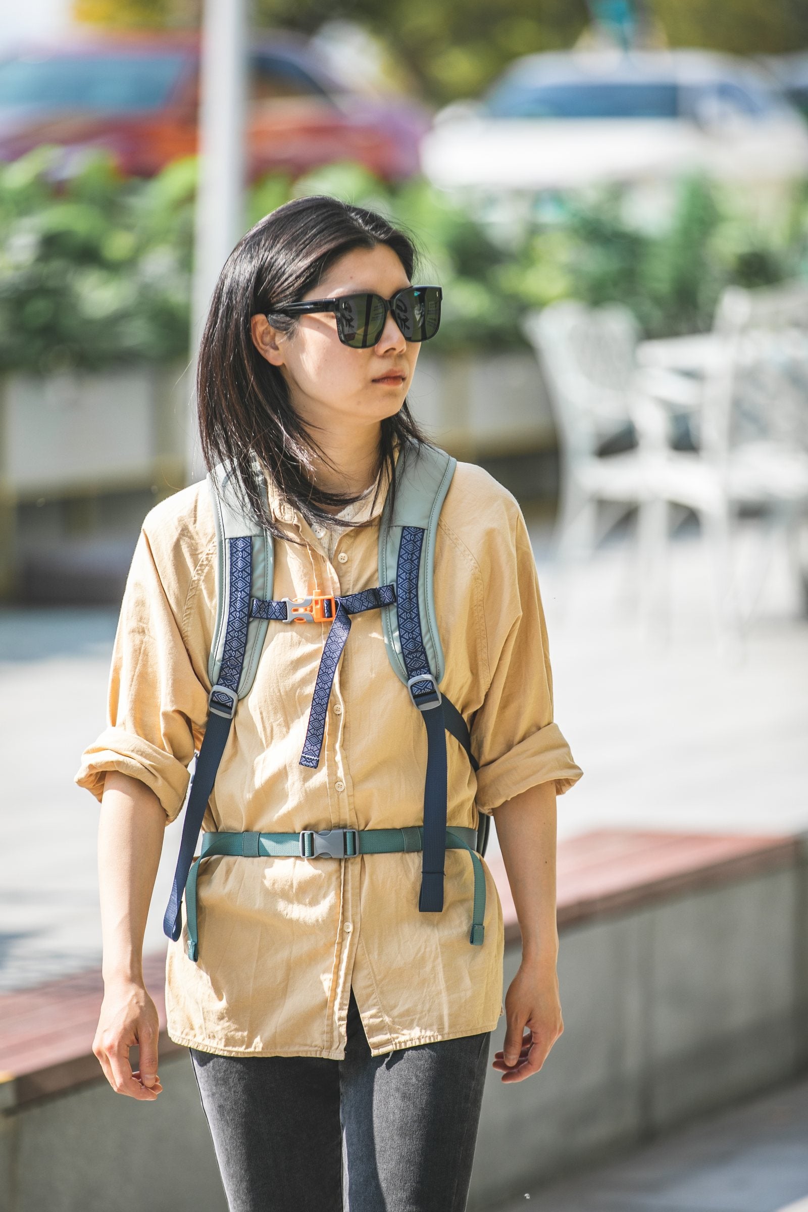 Person wearing the Sage Leaf CRUISER backpack with the sternum strap and waist belt visible